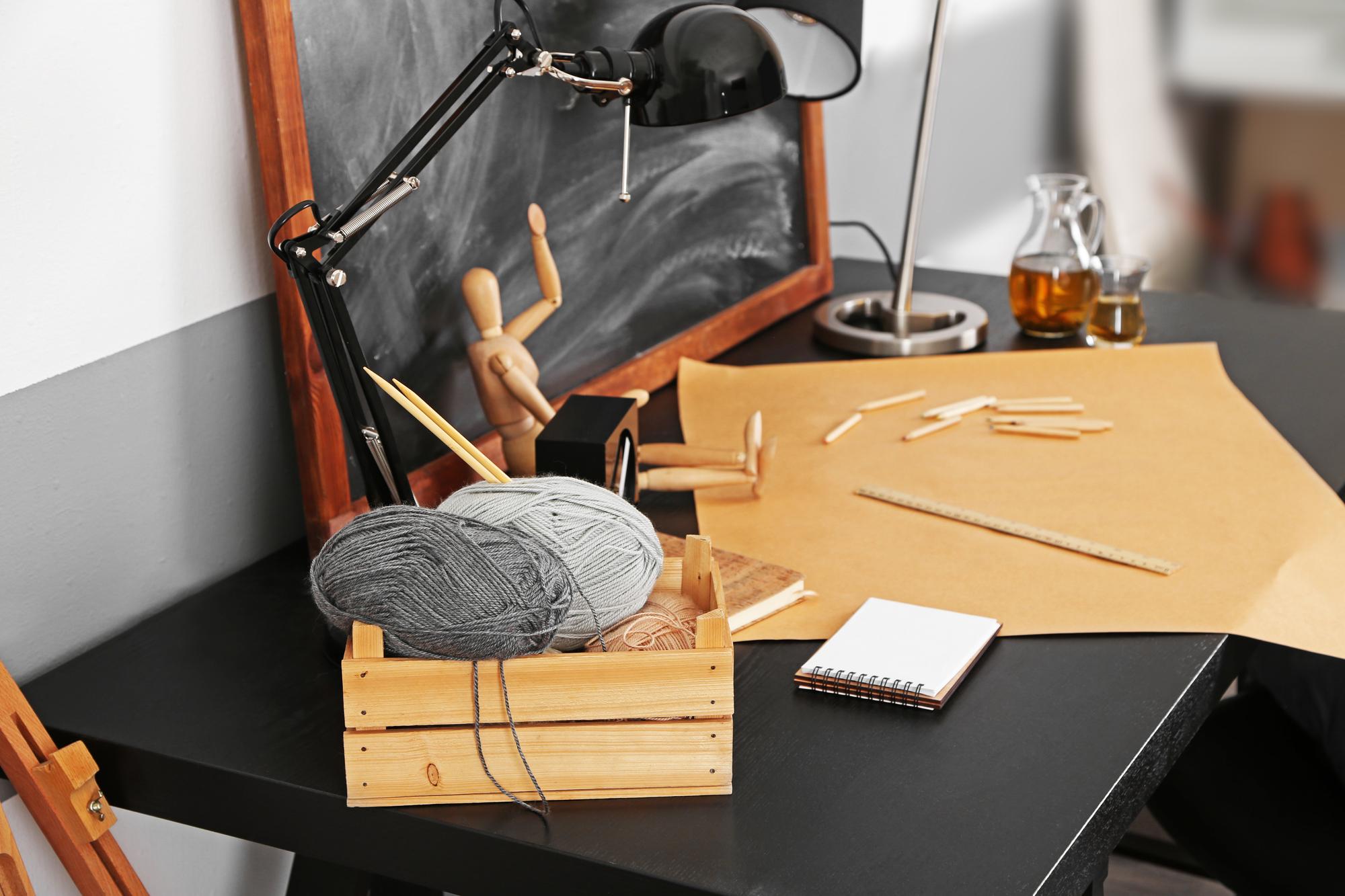 Workshop table with threads and needles