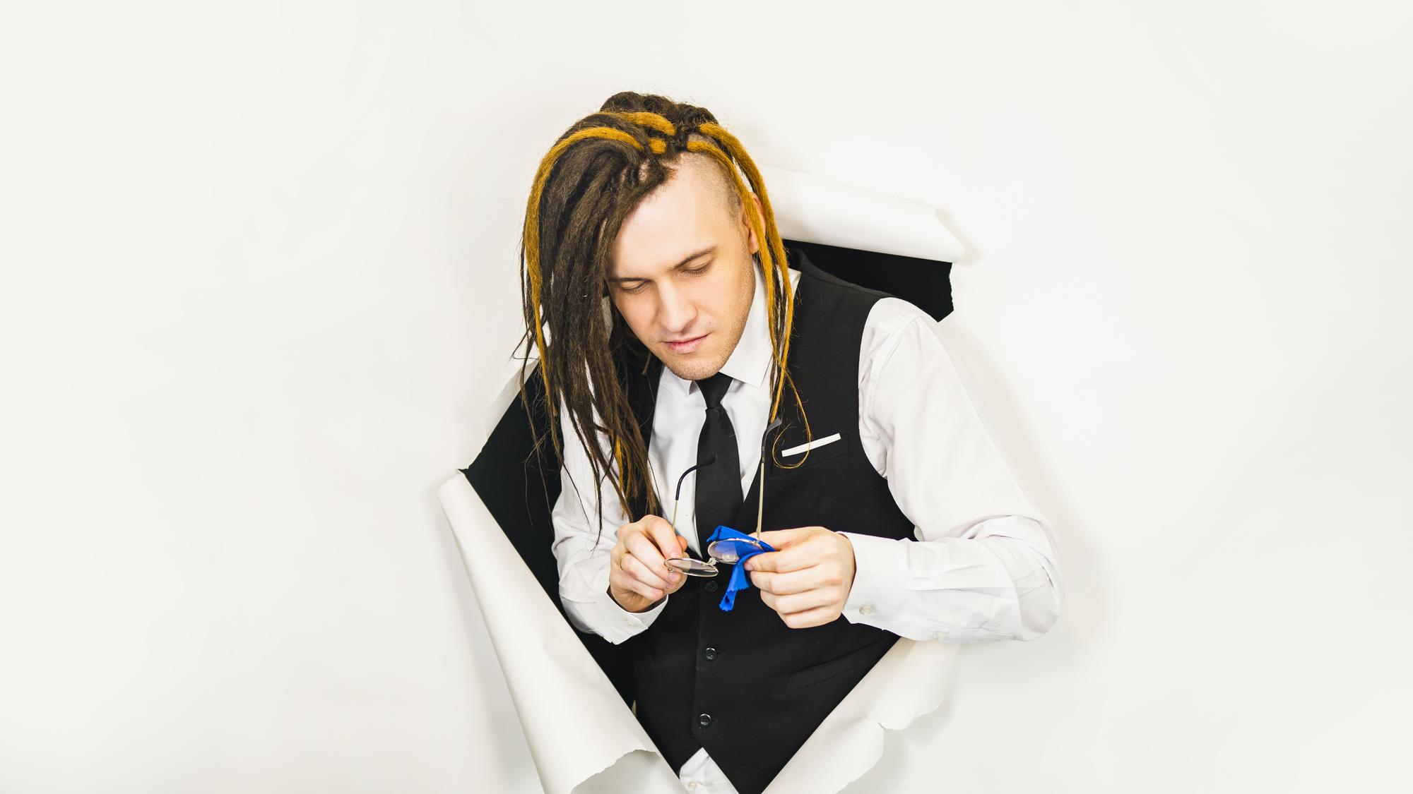 Instructor demonstrating stitching technique in studio